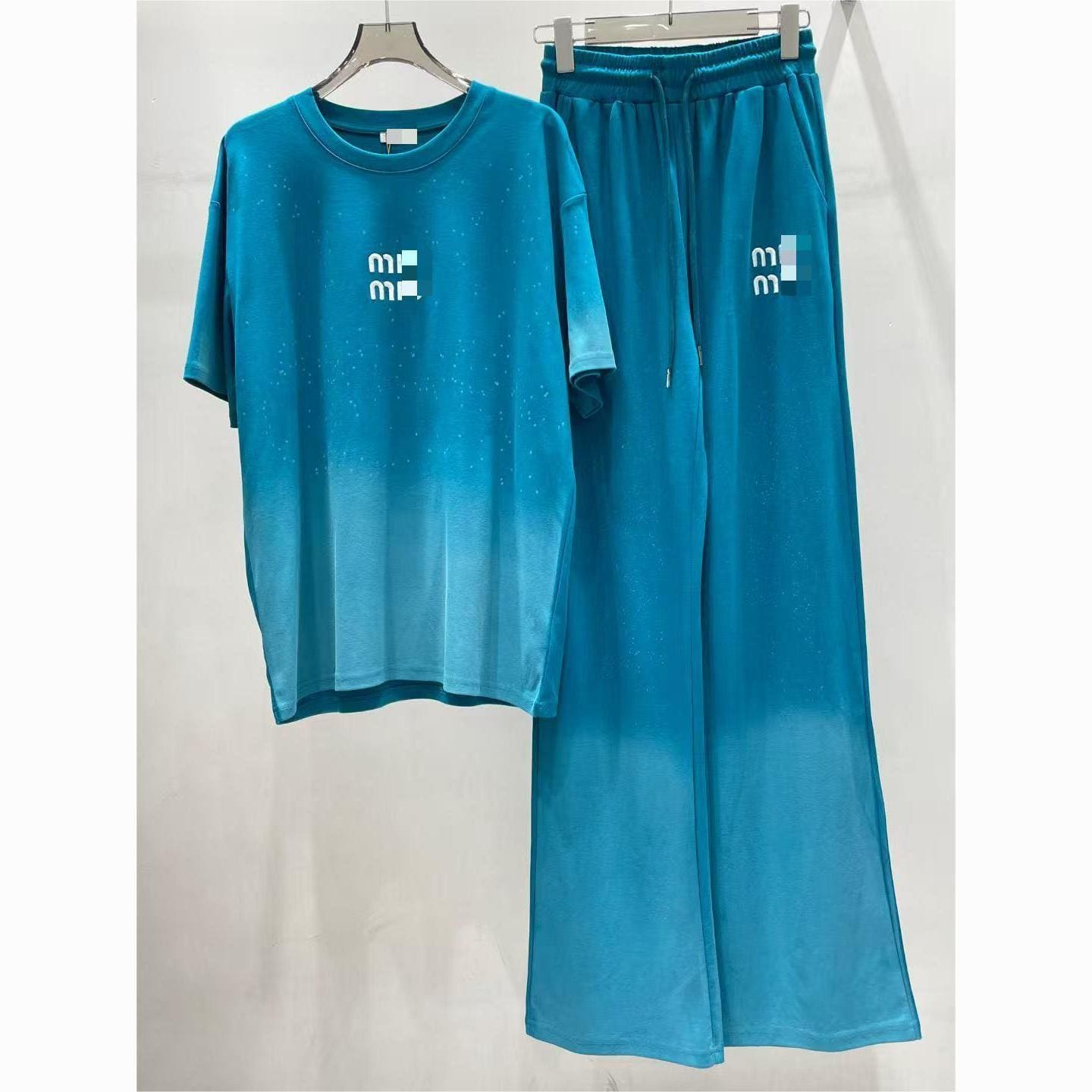O1CN01In3Tbb1Vk4TUOI2Tb_2219417082690-0-cib.jpg New Short-Sleeve And Trousers Set For Women - Image 1